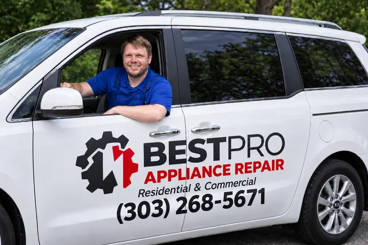 Best Pro Appliance Repair technician in a white branded minivan
